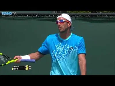 Troicki flies over the net in Miami against Goffin